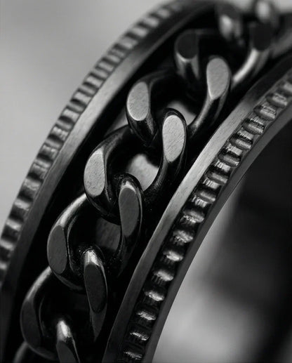 The Obsidian Kinetic: Industrial Chain Spinner Band