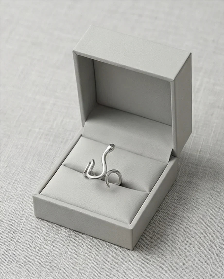 Silver Coil: Sleek Sculptural Serpentine Ring