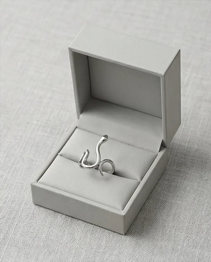 Silver Coil: Sleek Sculptural Serpentine Ring