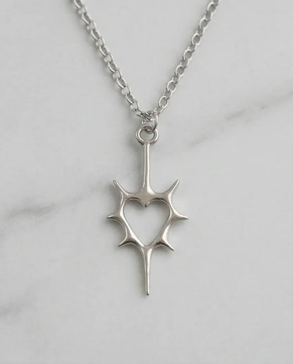 The Thorned Aura: Spiky Heart Statement Necklace
