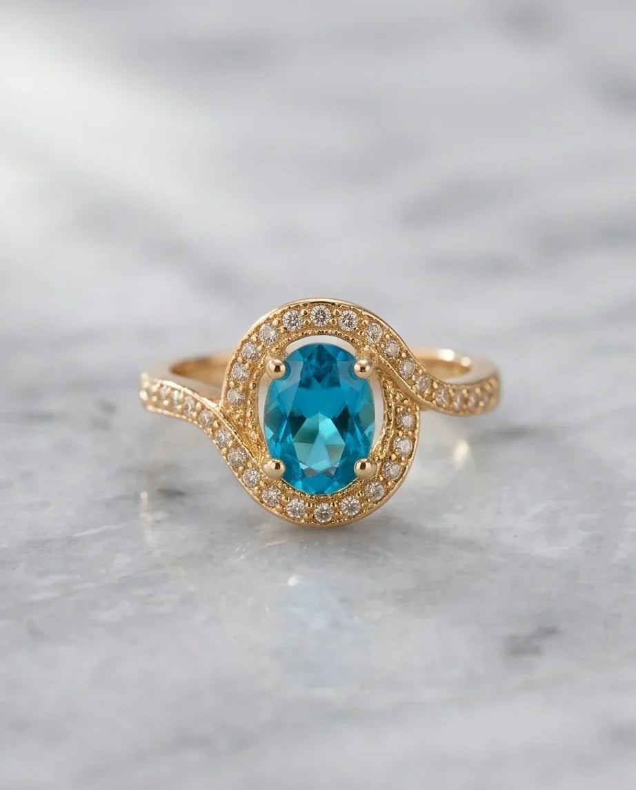 Luxury Gold Oval Swiss Blue Topaz Swirl Halo Ring