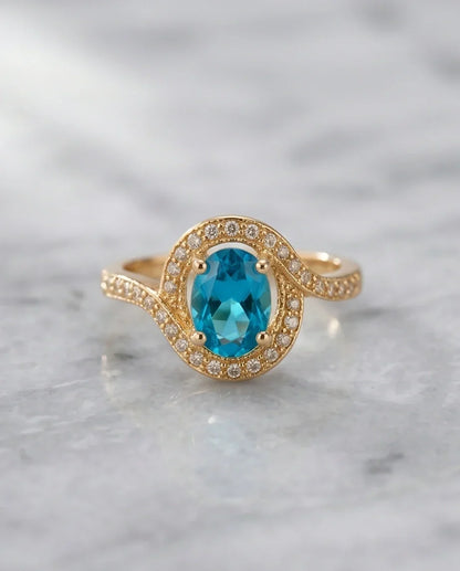 Luxury Gold Oval Swiss Blue Topaz Swirl Halo Ring