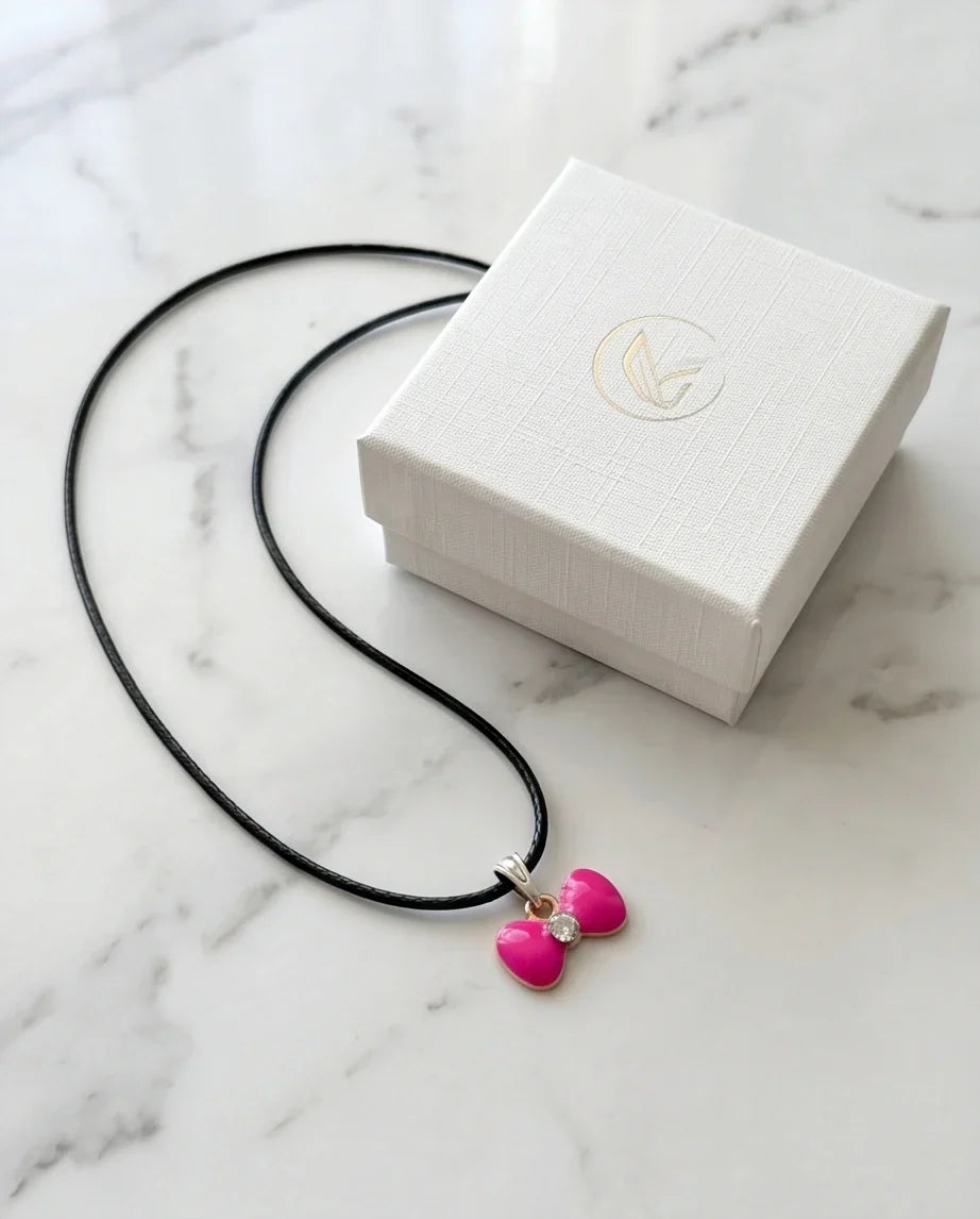 Gold and Pink Crystal Bow Necklace