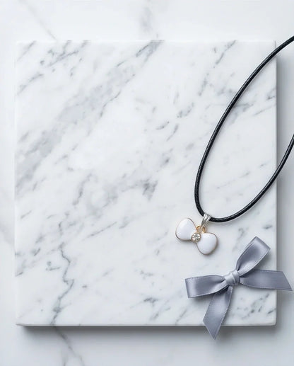 Gold and White Bow Tie Pendant Necklace