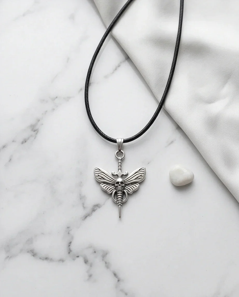 The Shadow Wing: Gothic Skull Moth Dagger Pendant Necklace